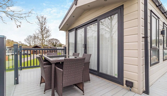 Lovely lodge set on a beautiful site with woodlands and fishing lakes.