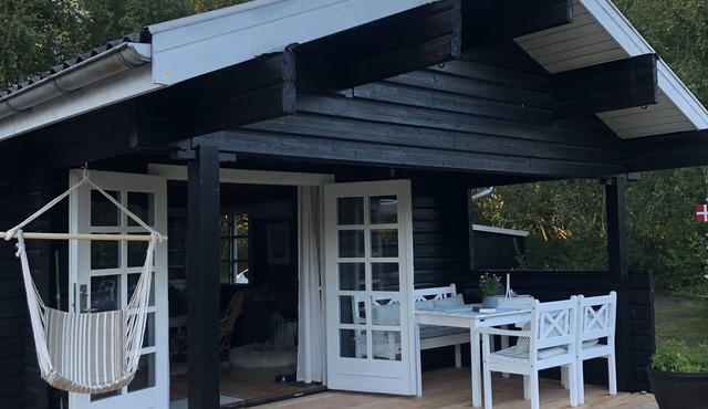 Lovely log house next to protected plantation