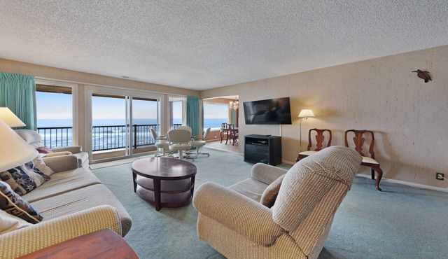 Lovely oceanfront condo with sweeping water views, & balcony
