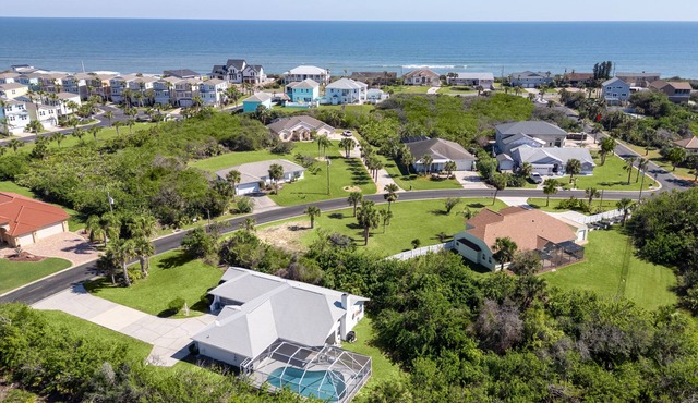 Lovely oceanside heated pool home with beach access a short stroll away!