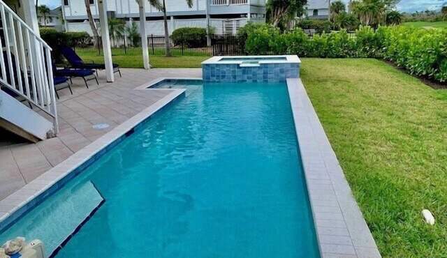 Lovely pool home with golf course views in The Dunes community