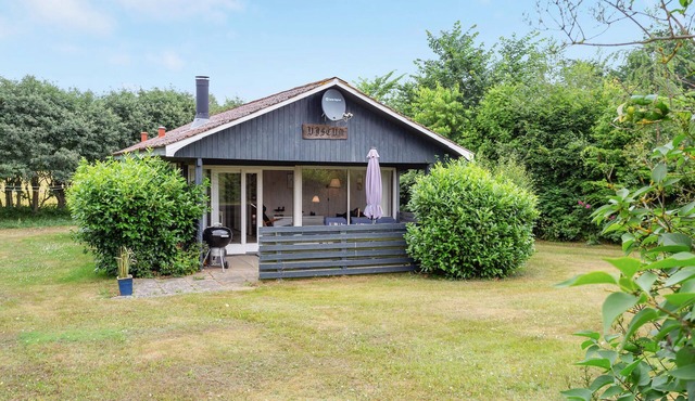 Lovingly furnished cottage on well-kept grounds with lawn and space for ball games.