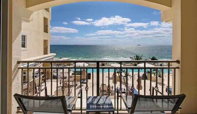 LOW PRICE but HIGH ENJOYMENT! Wake up to oceanfront views from your 2 Queen beds