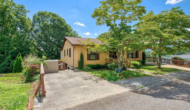 Lower-level lake retreat with mountain views, pool, central AC, deck, grill