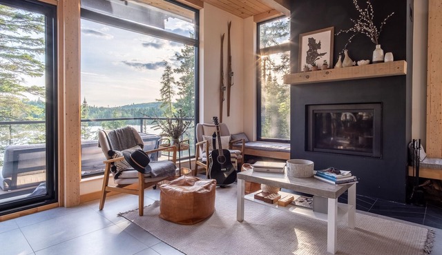 Luxury waterfront chalet with fireplace, dock, quiet lake & hot tub