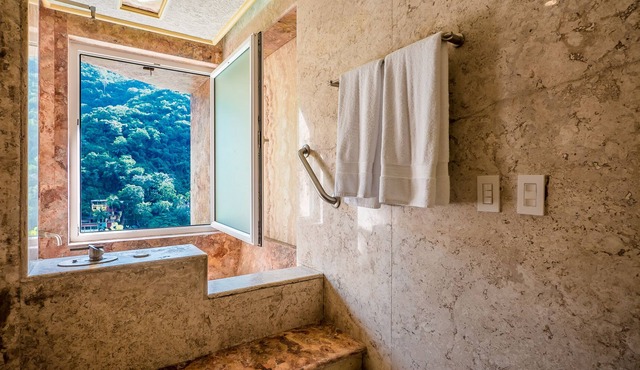 Luna Suite with two king size beds, with walk out terrace overlooking the beach