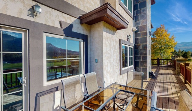 Luxe home on Gypsum Creek Golf Course with fireplace and mountain views