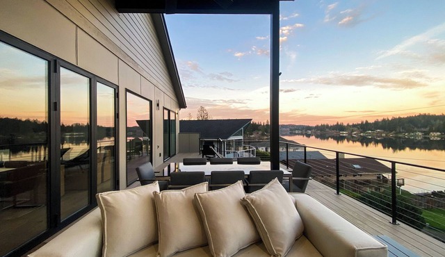 Luxe Port Lookout with waterfront with dock, theater, game room, and huge deck