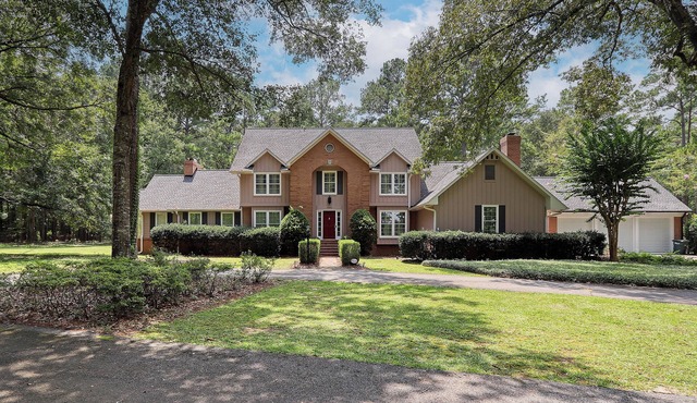 Luxurious 4-Bedroom Retreat with Theater, Pool, Hot Tub, and Bar on 6 acres.