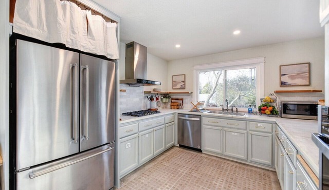 Luxurious 5BR, 3BA home with full kitchen, 2 living rooms, office and yard.