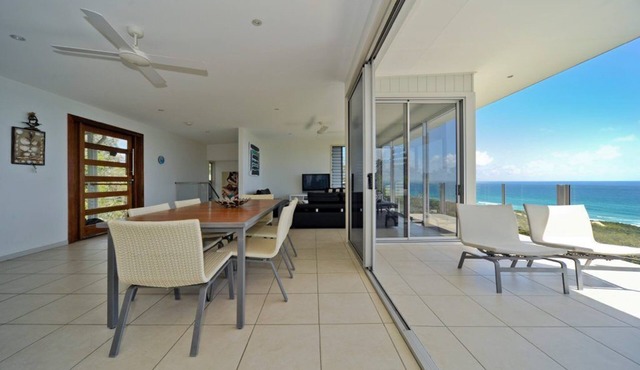 Luxurious beach house high above Home Beach with 180 degree ocean and.