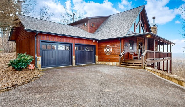 Luxurious cabin with breathtaking mountain views and multiple outdoor fireplaces