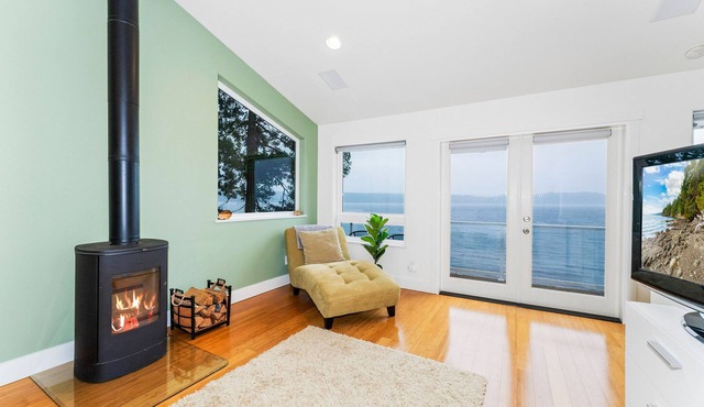 Luxurious home with private beach access and wood burning fire place