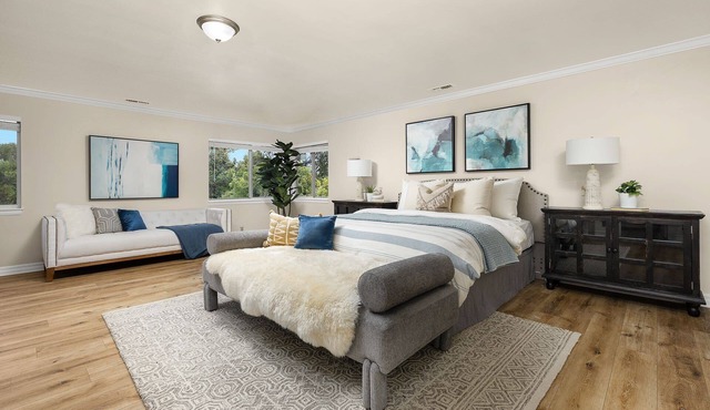 Luxurious large master bedroom with separate refrigerator coffee maker bathtub