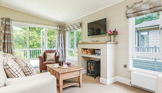 Luxurious lodge with one king-size double, with en suite shower and one twin.