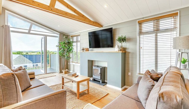 Luxurious lodge with vaulted ceilings and a welcoming feature fireplace.