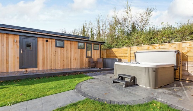 Luxurious lodge with vaulted ceilings and a welcoming feature fireplace.