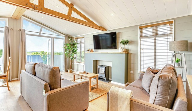 Luxurious lodge with vaulted ceilings and a welcoming feature fireplace.