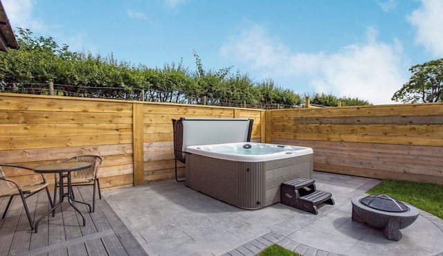 Luxurious lodge with vaulted ceilings and a welcoming feature fireplace.