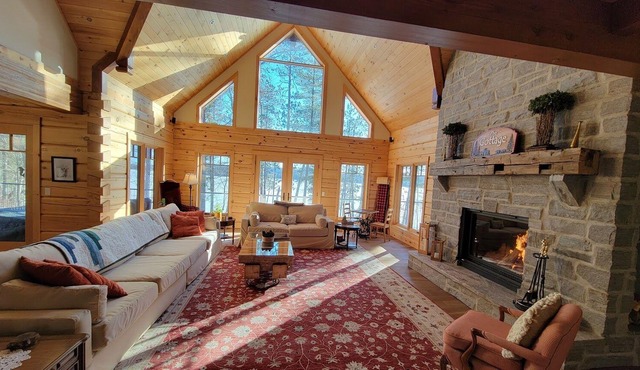 Luxurious log cottage with 600-feet of waterfront, 90 Acres.