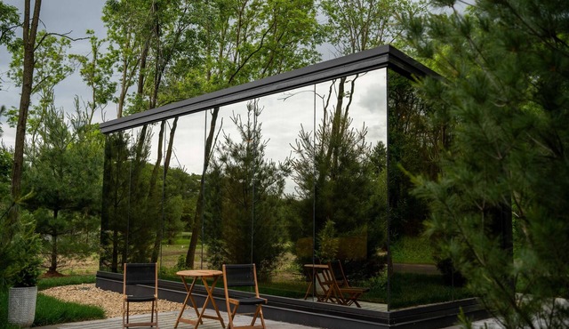 Luxurious mirrored cabin nestled on the Woods & Co Weddings + Events property for the ultimate getaway