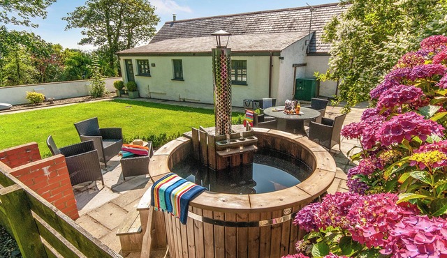 Luxurious Pembrokeshire farm cottage with a wood fired hot tub and sauna.