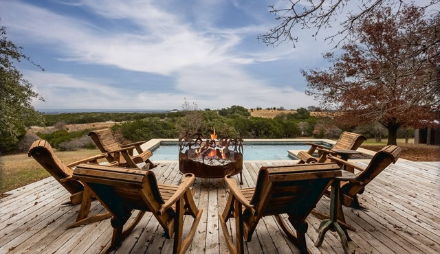 Luxurious property with pool, hot tub, wraparound porch, & two primary suites