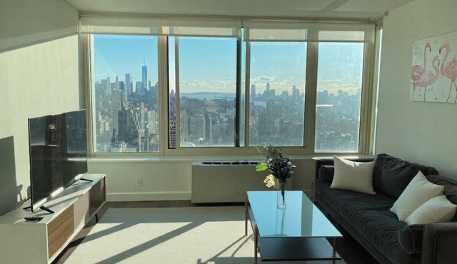 Luxury 1BR Floor-to-Ceiling Views Steps from Empire State & MSG