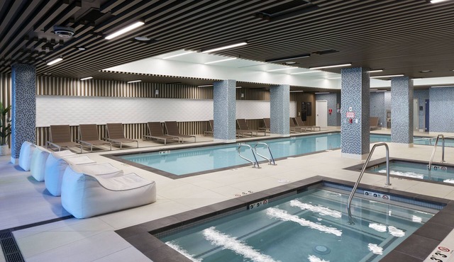 Luxury 2BR Suite w/Pools, Fitness, Private Balcony & Gourmet Kitchen in Seattle