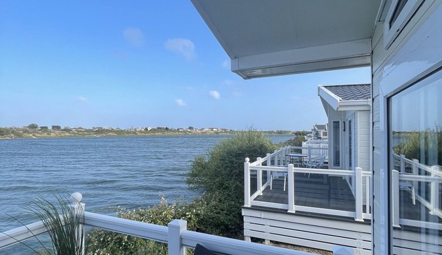 Luxury 3 bedroom waterside lodge, a stones throw from Pagham beach and harbour.