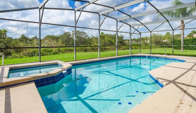 Luxury 5 bed 4 bath SW facing pool with conservation and lake view