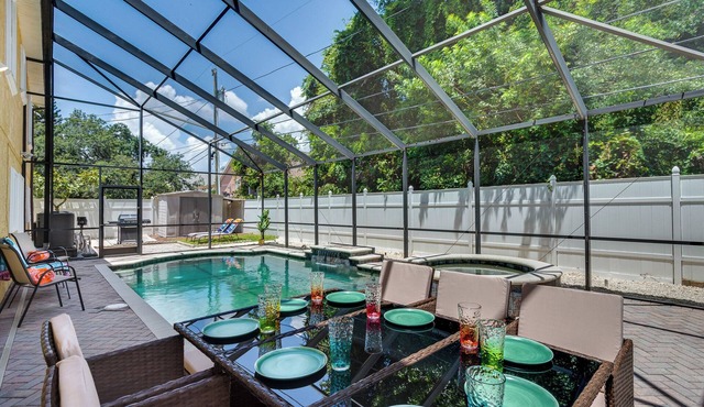 Luxury 5 Bedroom Dunedin home ~ TWO full kitchens, heated pool, hot tub!