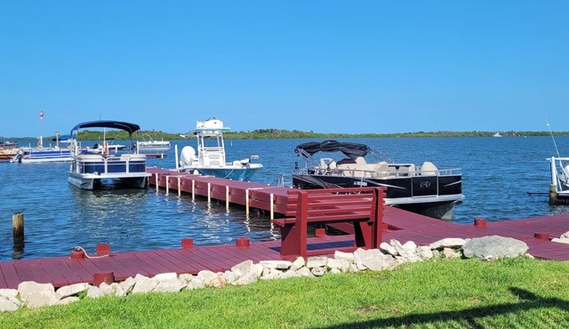 LUXURY 5TH WHEEL WITH FULL DECK directly on the water