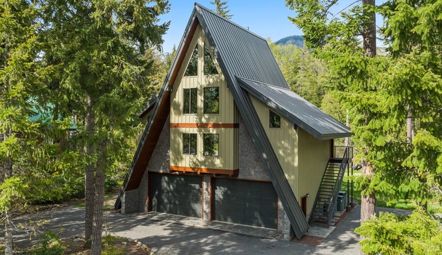 Luxury A-Frame Lodge on a river, surrounded by mountains