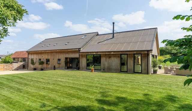 Luxury, architect designed 7 bedroom barn conversion in idyllic rural setting.