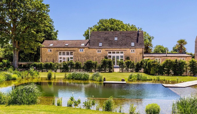 Luxury barn conversion on rural Cotswolds farm with swimming pond