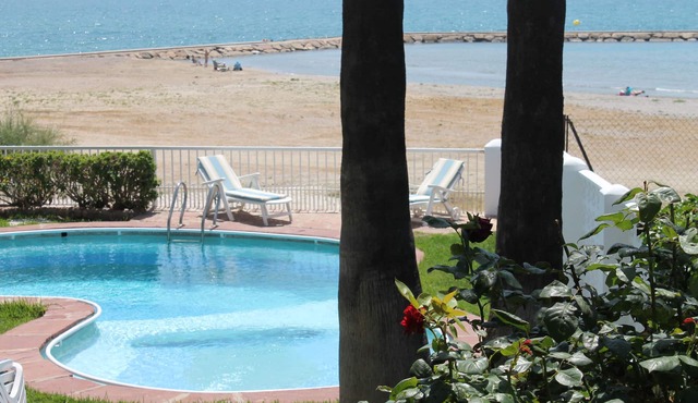 Luxury beachside villa with private pool, terrace and sea views.