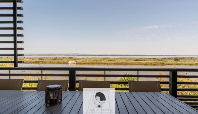 Luxury building with pond view and parking