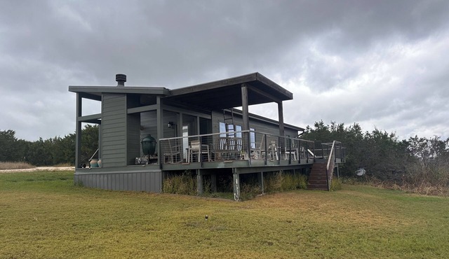 luxury Cabin fireplace and covered deck. Located near Glen Rose TX. Cabin 1 of 2