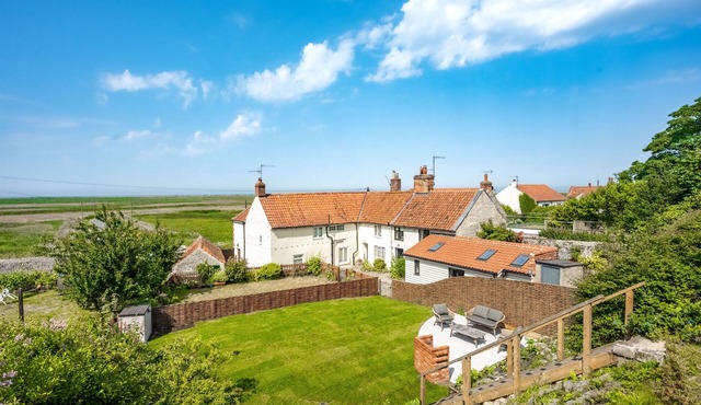 Luxury Cottage with Stunning Panoramic Views of Coastline from gardens.