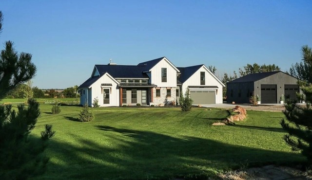Luxury Farmhouse on 50 acres with a pond and private beach in the backyard. Wow