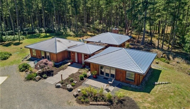 Luxury four bedroom home on sixteen acres of wooded privacy.