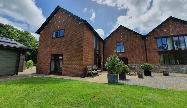 Luxury barn conversion sleeping 16 with hot tub and ensuite bedrooms