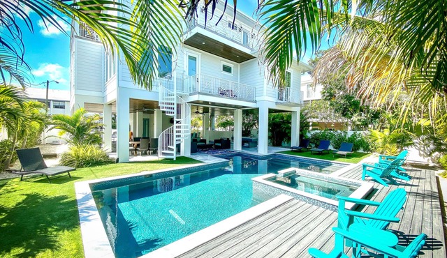 Luxury home just steps away from the beach with pool, spa and rooftop!