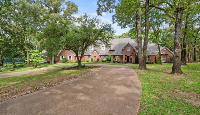 Luxury home on 27 wooded acres with two private lakes in Athens, Texas.