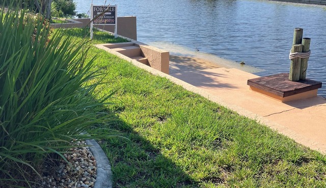 Luxury home on the canal with salt water pool and lanai in Cape Coral
