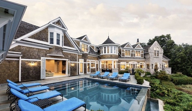 Luxury home with infinity pool overlooking Lake Michigan, outside turf play area