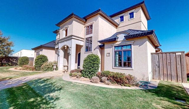 Luxury home with private pool, waterslide, grill, home theater, & office