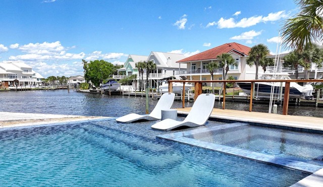 Luxury Infinity Edge Heated/Cooled Pool & Hot Tub + Boat Dock & Marine Station + Walk to the Beach + Beach Packages