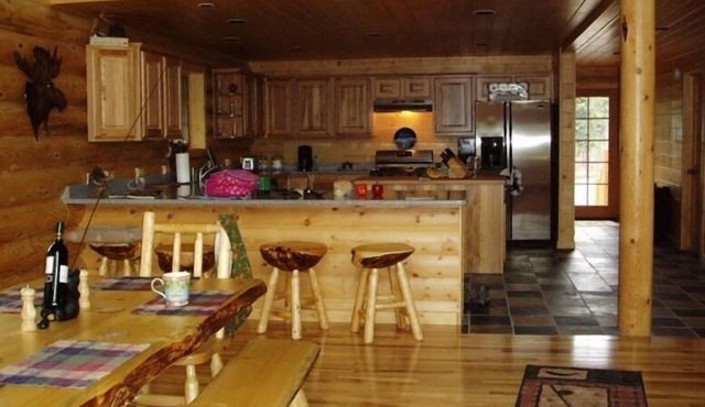 Luxury Kenai River Front Lodge, private fishing ramp, owner assisted activities.